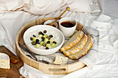 Breakfast in bed - rice porrige with honey and melon, blueberries