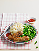 Bangers and mash with peas