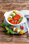 Cold tomato soup with mozzarella skewers