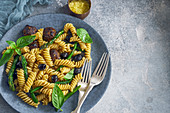 Rotini pasta with meatballs, asparagus and olives