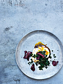 Cavolo nero tartare with beetroot crisps and egg