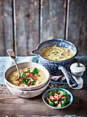 Leek and butter bean soup with crispy kale and bacon