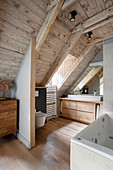 Ensuite attic bathroom with wood panelling on ceiling