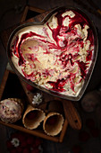 Heart shaped tin filled with raspberry ripple ice cream