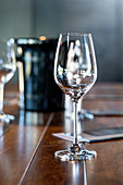 Wine glasses on a wooden bar