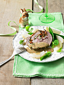Lamb roulade with a creamy herb sauce and vegetables