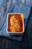 Gratinated cheese dumplings in tomato coulis