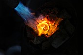 Goldsmith using blow torch