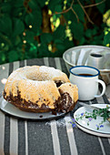 Vegan marble Bundt cake on a table laid for coffee in a garden