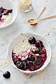 Rice pudding with cherries and flaked almonds