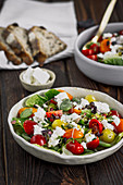 Tomatoe salad with broad beans, Manouri cheese and pistachios