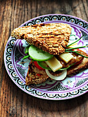 Wholemeal sandwich with avocado, cheese and cucumber