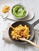 Scrambled eggs with avocado and broccoli purée