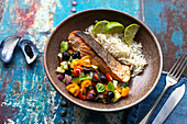 Fried salmon with avocado salsa and rice