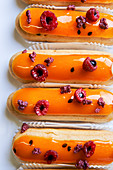 Eclairs with raspberries