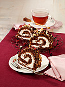 Chocolate brownie Swiss roll with walnuts and cranberries