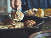 Köttbullar (Swedish meatballs) in a cast iron pan