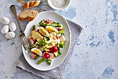 Egg salad with radish and wild garlic