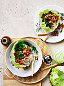 Vegetable-packed san choy bow with vermicelli noodles (tofu vs. pork)