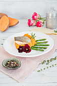 Fried salmon trout with mashed sweet potatoes and green Thai asparagus