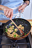 Preparing Orecchiette in a pan