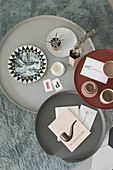 Bird's-eye view of vintage-style accessories on three round coffee tables