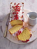 Coconut box cake with sugar icing and pomegranate seeds