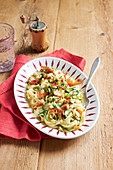 Light vegetable carbonara with courgette, carrots and bacon
