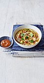 Chinese chicken noodle soup with peanut sauce