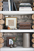 Shelving panelled with rustic logs