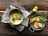 Zucchini cream soup with toasted bread