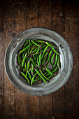 Green chillies on a metal plate