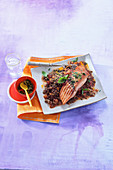 Spicy piece of salmon with orange lentils