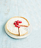 Cheat’s Manchester tart with coconut and raspberries