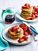 Basic pancakes with strawberries and maple syrup