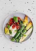 Roast zucchini flowers with tomato confit and burrata