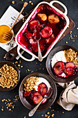 Baked plums with honey, yoghurt and granola