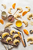 Baking croissants with orange cream and almonds