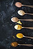 Teaspoons with types of corn flour wheat flour buckwheat sugar and salt