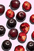 Plums on a pink background