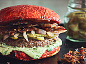 Red hamburger with candied bacon