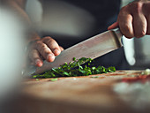 Chopping fresh herbs with a knife