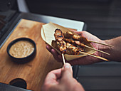 Grilled sate skewers with peanut sauce