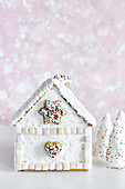 Christmas gingerbread house decorated with marshmallows and royal icing