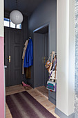 Foyer with grey walls and doors