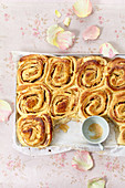 Apple and cinnamon yeast rolls on a tray