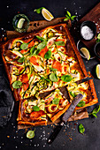 Tart on french pastry with salmon, zucchini and basil
