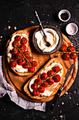 Toasts with creamy cheese and cherry tomatoes