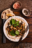 Flat bread with goat's cheese, fried oyster mushrooms and spinach