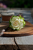 White and green ornamental cabbage decorating wooden board
